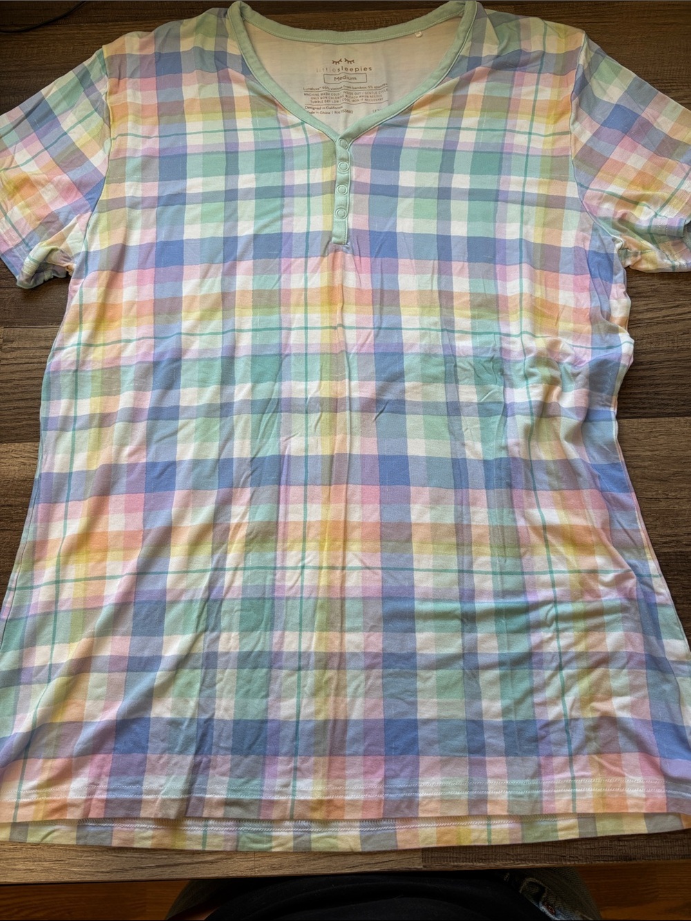 LIKE NEW Little Sleepies henley top features a pastel plaid pattern.